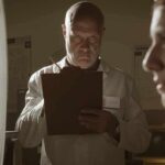 Fauci Bombshell Rocks DC Scientist with clipboard observes woman beside spiral target