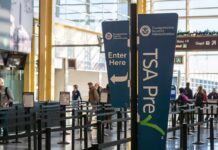 Gunshots Trigger CHAOS at Major U.S. Airport TSA PreCheck sign at airport security
