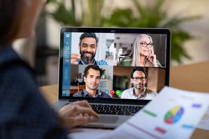 shutterstock_1676998309 Laptop screen showing a four-person video conference call