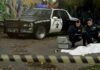 FBI FOILS ISIS-Inspired Mass Shooting Plot FBI agents examine a covered body at a taped-off crime scene