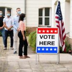 Carville ERUPTS at Socialists Inside Democratic Party Voters wearing masks line up outside a polling place