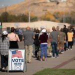 Front-Runner Ambushed By Washington voters standing in a long line outside a polling place
