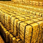 Why Is the Netherlands Moving BILLIONS in Gold? Stacks of gold bars strapped together in a vault