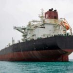 CENTCOM Strikes On Iran Ignites Price Spike Large oil tanker anchored in calm sea