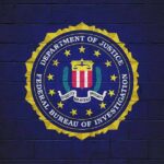 Huge Terror Numbers, Zero Method FBI seal painted on a dark brick wall