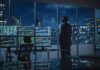 He Compared AI to Nukes Then Said Keep Going Trader in a dark office with multiple stock monitors and city skyline at night