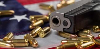 Handgun with bullets on an American flag