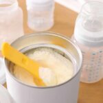 Baby Formula Giant Writes $385M Check Over a Dirty Plant Infant formula powder with yellow scoop in open can