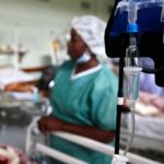 IV drip and blood pressure gauge in a hospital ward