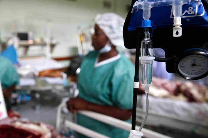 IV drip and blood pressure gauge in a hospital ward