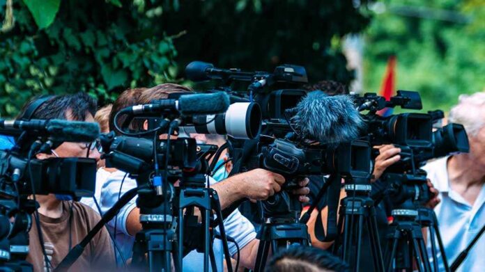 Group,Of,Cameras,At,An,Outdoor,Event TV news cameras crowding together at an outdoor event