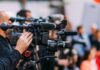 A New ‘Kill Web’ Could Change Air Combat Video cameras on tripods at a media event