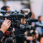 Hackers Cripple 911 System, California City Declares Emergency Video cameras on tripods at a media event