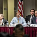 Jim Jordan speaks at a committee hearing with Jerrold Nadler and Darrell Issa seated beside him
