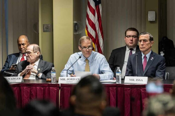 shutterstock_2290525775 Jim Jordan speaks at a committee hearing with Jerrold Nadler and Darrell Issa seated beside him