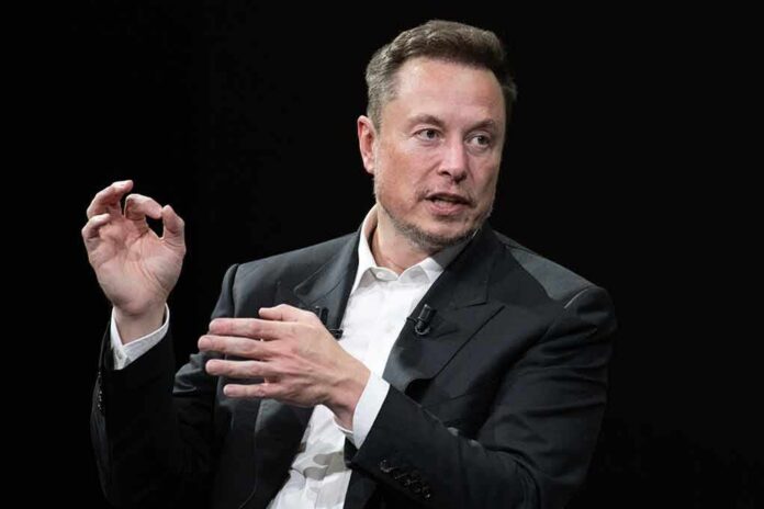 shutterstock_2318800321 Elon Musk speaking in a black suit against a dark background
