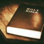 Vance’s Communion Sparks Political Fire Holy Bible on a wooden table