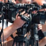 Mega Blaze Threatens Madrid television cameras on tripods at a media event
