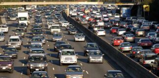 A busy highway filled with cars in a traffic jam