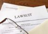 GTA Leak Backfires: Subpoenas Fly Legal documents labeled lawsuit on a desk