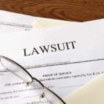 GTA Leak Backfires: Subpoenas Fly Legal documents labeled lawsuit on a desk
