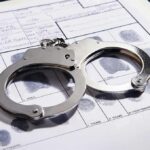 Handcuffs on a fingerprint record form