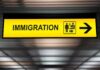 Immigration sign with arrow in airport
