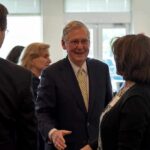 Mitch McConnell greets Eileen Caddy at a gathering