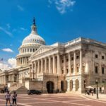 Democrats Crack Over ICE Cash United States Capitol building with dome and columns under a blue sky