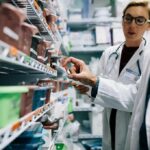 Mystery Cow Outbreak Rattles Switzerland Pharmacists selecting medication from pharmacy shelves