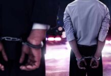 They Stole Meals Meant for HUNGRY Kids Two men in handcuffs with police lights in the background