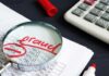 Ilhan Omar’s Husband’s Winery Accused of FRAUD Magnifying glass over financial spreadsheet with red marker and calculator