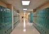 Hidden CAMERA Found Where Young Gymnasts Changed School hallway with rows of teal lockers
