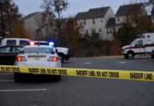 Partygoers PLUNGE as Homecoming Deck Gives Way Sheriff's vehicles behind yellow do-not-cross tape
