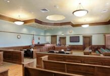 Judge Locked 2 Children in JAIL Empty courtroom with wooden benches and judge's bench