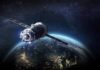 Satellite orbiting Earth over night side