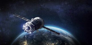 Satellite orbiting Earth over night side