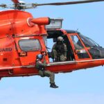 6 Vanish After Midair Emergency Rescue helicopter with crew performing hoist operation