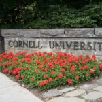 Cornell Had WARNING Signs Before Frat Horror Cornell University stone sign with red flowers