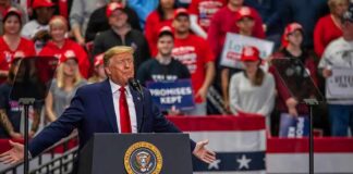 Donald Trump speaks at a rally; Teddy Williams and Bear Pascoe are in the crowd