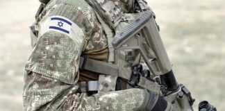 soldier in camouflage holding a rifle