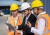 Construction team reviewing a tablet on site