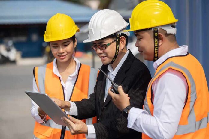 Construction team reviewing a tablet on site