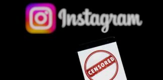 Smartphone showing censored symbol with Instagram logo in background
