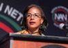 Susan Rice Has a WARNING for Trump Backers Woman speaking at a podium with a microphone