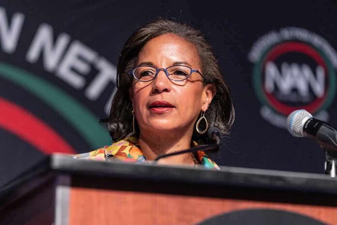 Woman speaking at a podium with a microphone