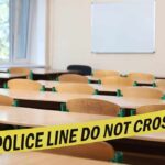 6-Year-Old Who SHOT Teacher Seen on Bodycam Empty classroom with police tape across desks