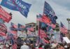 Crowd at political rally with many American and campaign flags