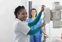 WH Chief of Staff Almost Skipped a Life-Saving TEST Radiologic technologist adjusting X-ray machine with patient standing behind