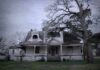 Old abandoned Victorian house with wraparound porch